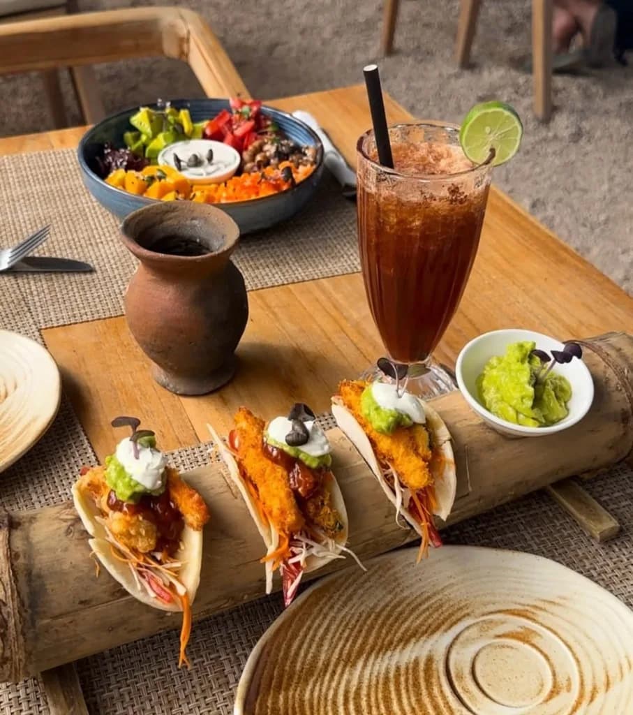 Tacos and tropical drink by the pool at Casa Coco
